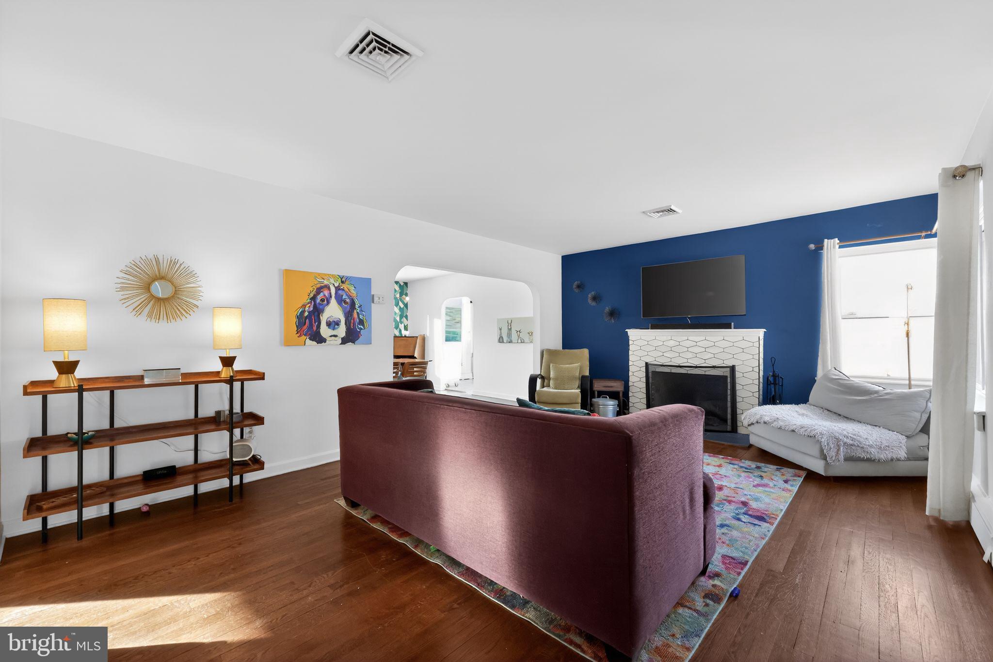 711 Brookhaven Road Wallingford, PA 19086 - Photo 4 of 35 a living room with furniture and a fireplace