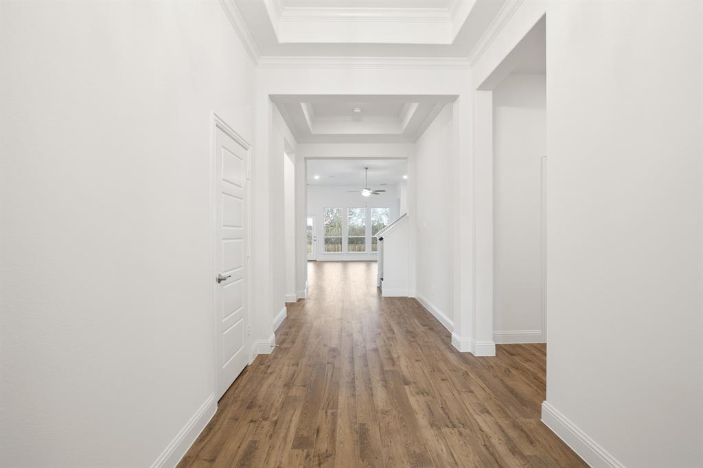 735 Oak Lavon, TX 75166 - Photo 2 of 39 a view of a hallway with wooden floor