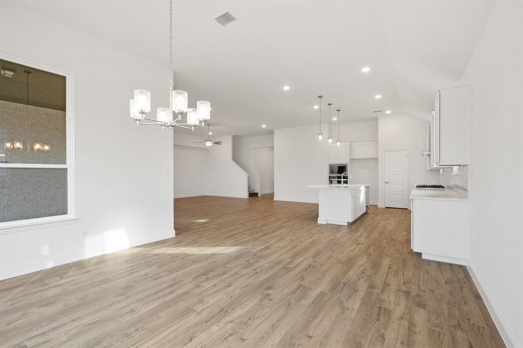 735 Oak Lavon, TX 75166 - Photo 22 of 39 a view of a kitchen and a chandelier