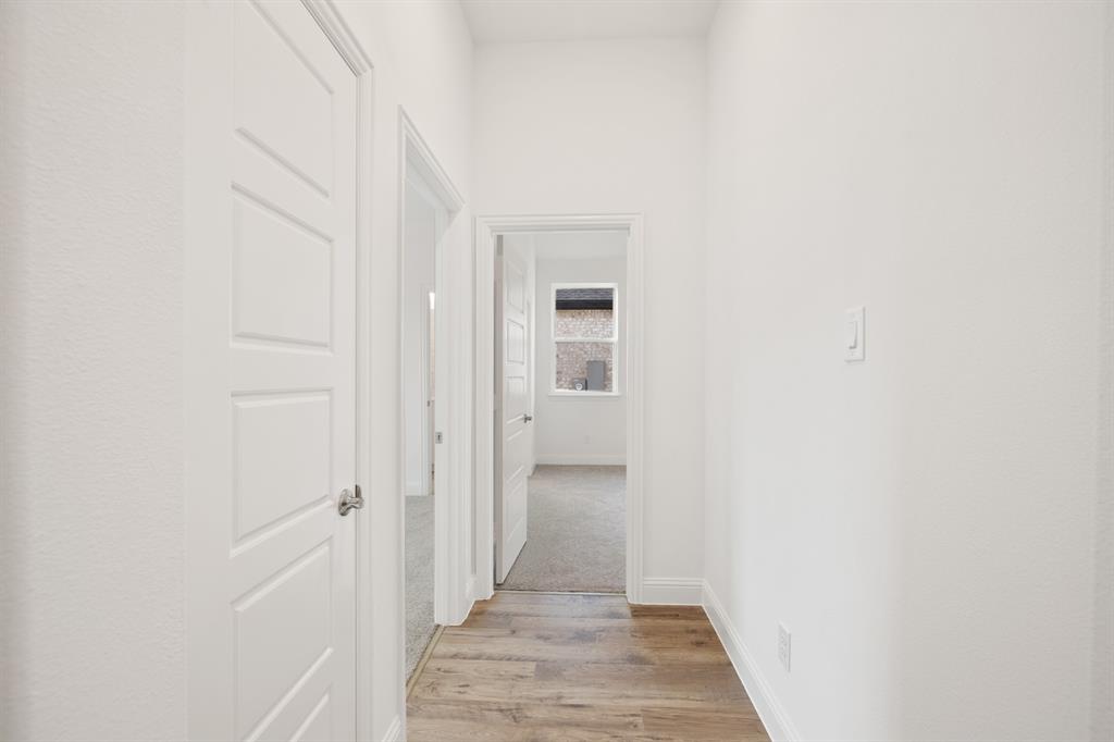 735 Oak Lavon, TX 75166 - Photo 3 of 39 a view of a hallway with wooden floor