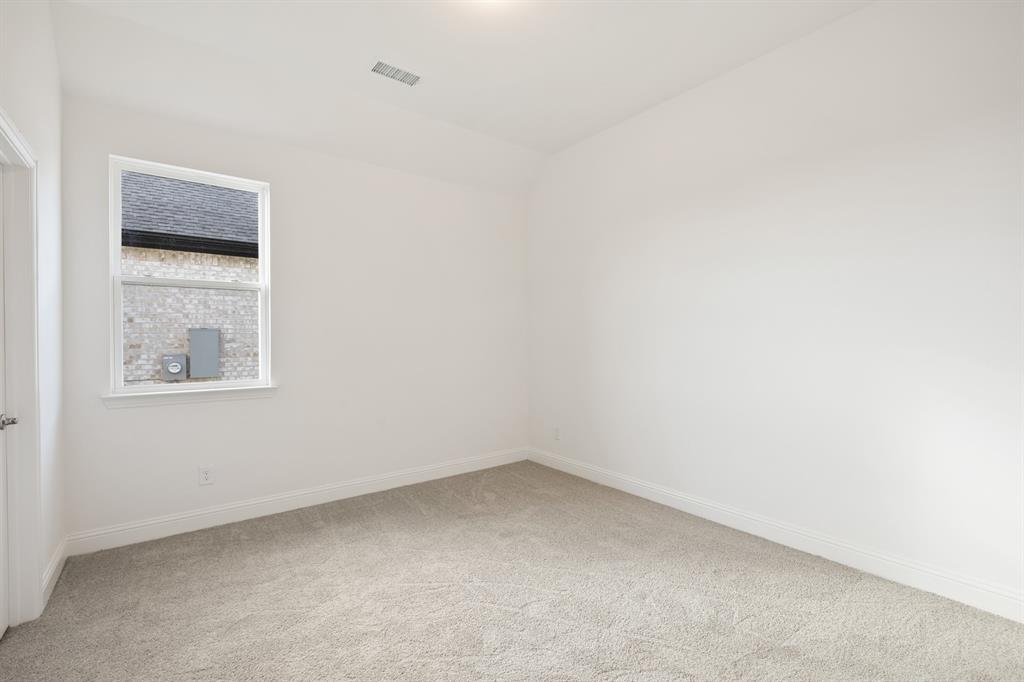 735 Oak Lavon, TX 75166 - Photo 7 of 39 an empty room with a window