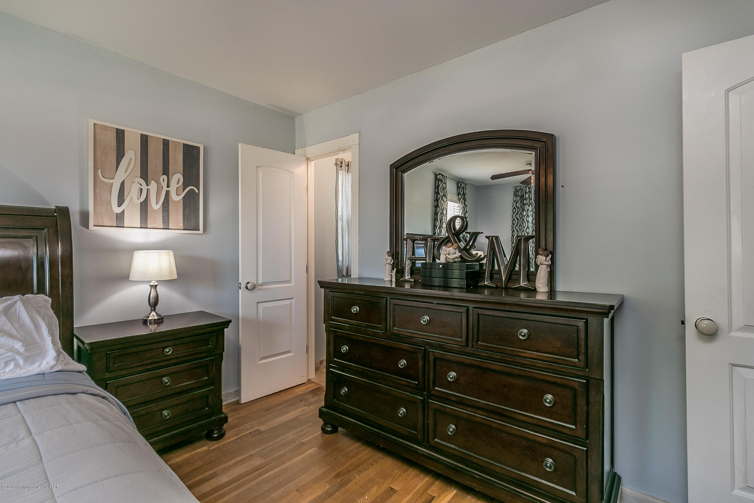 4709 South Austin Street Amarillo, TX 79110 - Photo 12 of 22 a room with two dresser and a mirror