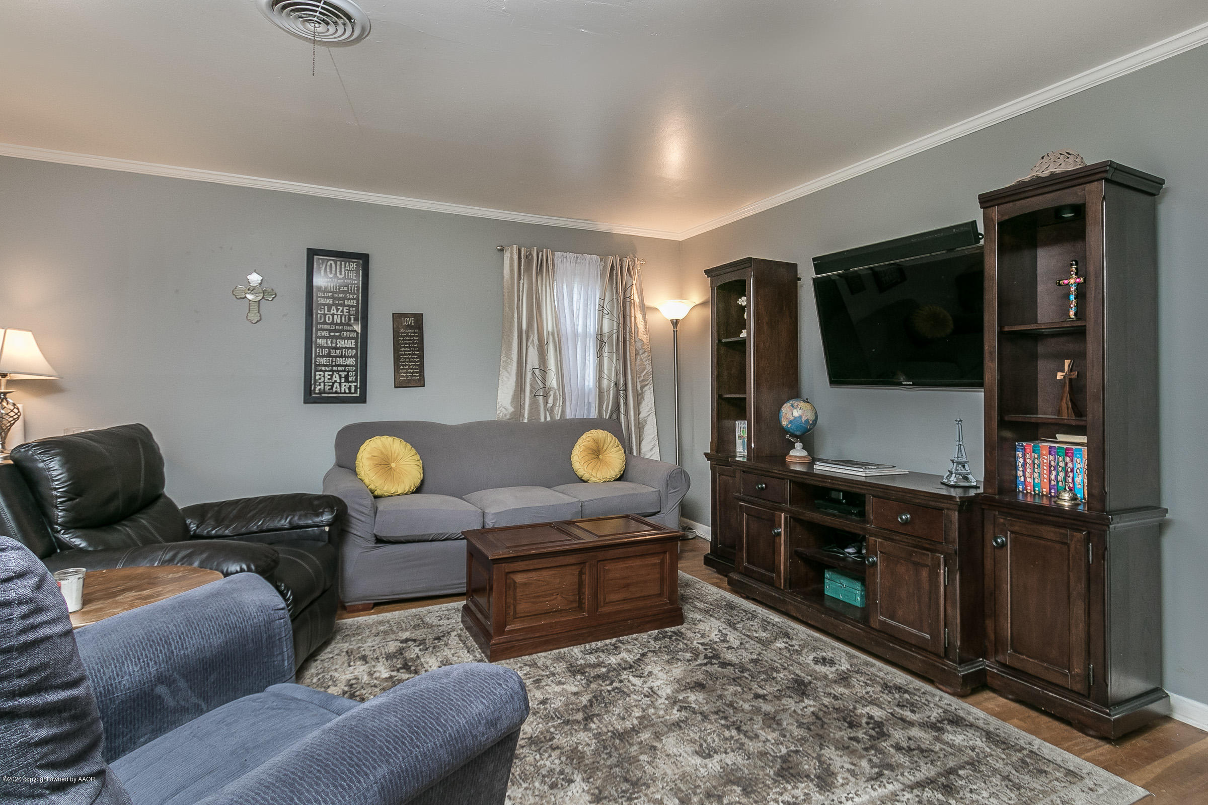 4709 South Austin Street Amarillo, TX 79110 - Photo 6 of 22 a living room with furniture and a flat screen tv