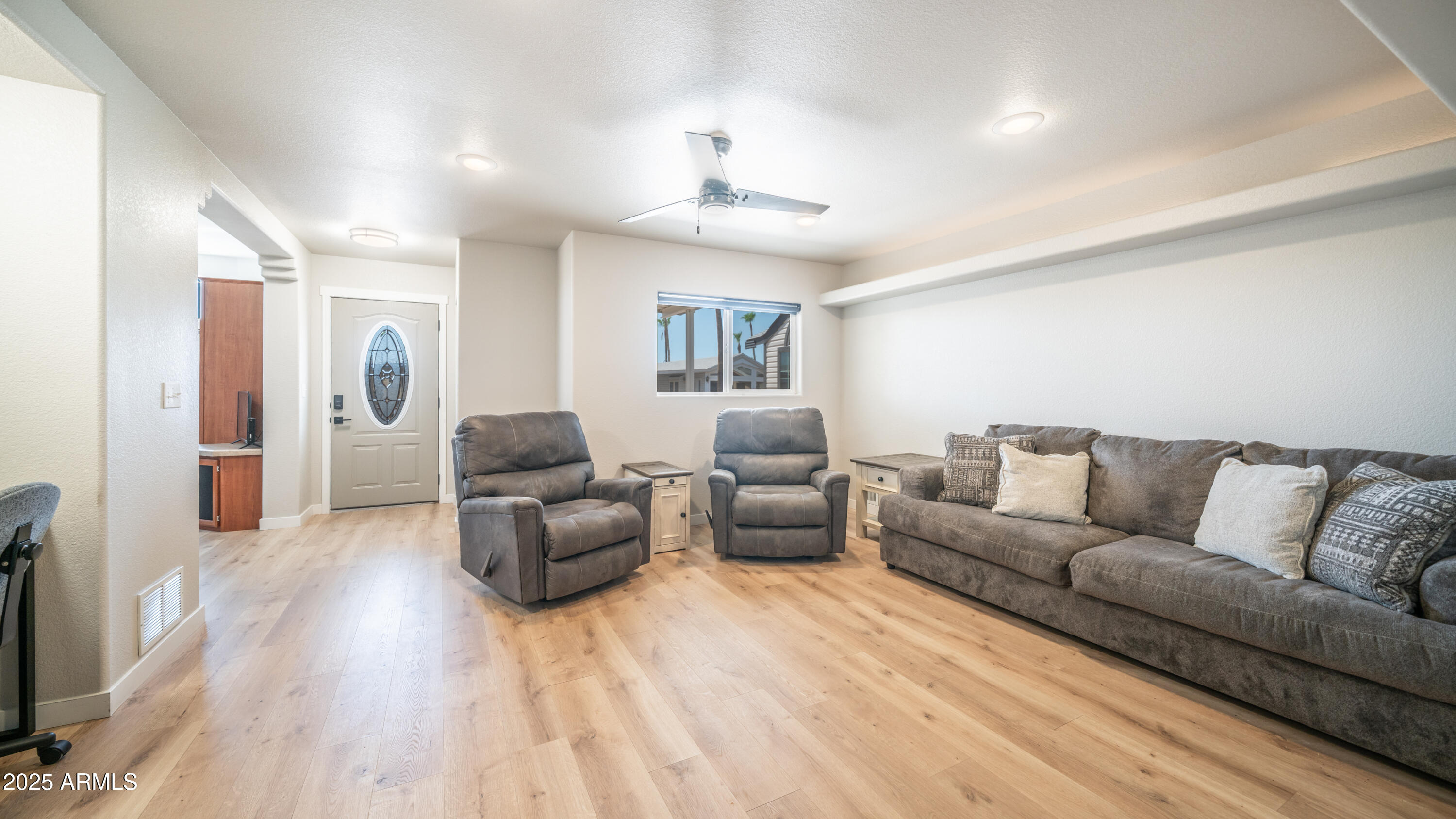 2400 East Baseline Avenue Apache Junction, AZ 85119 - Photo 11 of 64 a living room with furniture and a chandelier