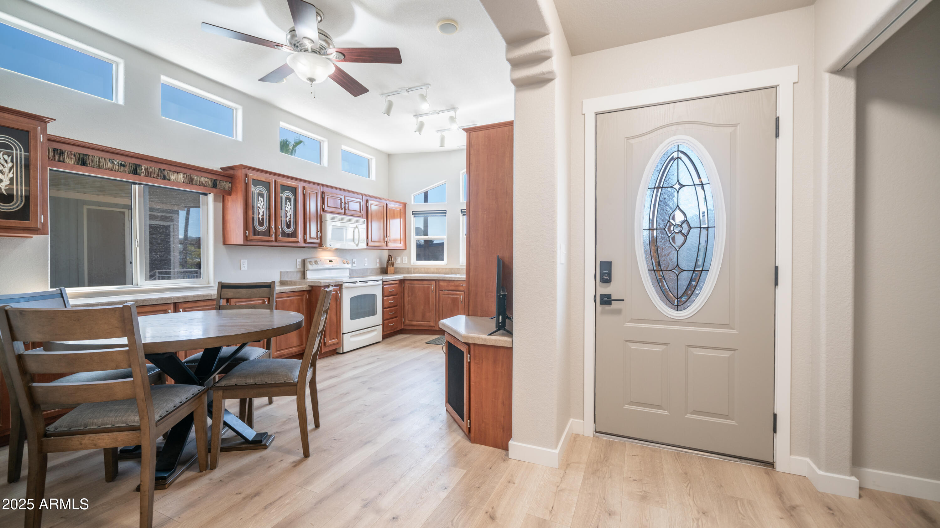 2400 East Baseline Avenue Apache Junction, AZ 85119 - Photo 13 of 64 a view of a dining room with furniture window and wooden floor