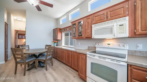a kitchen with a sink and refrigerator