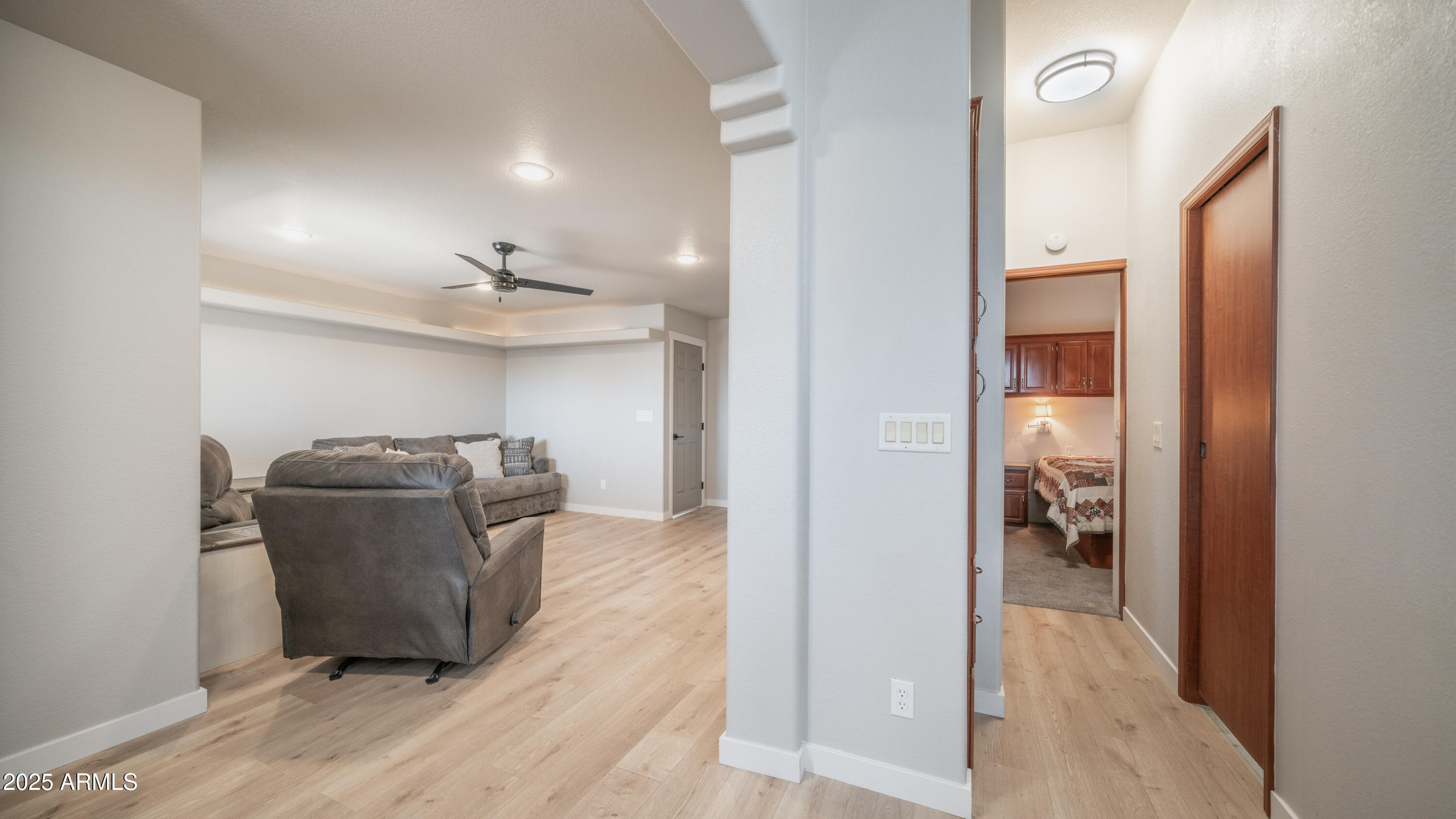 2400 East Baseline Avenue Apache Junction, AZ 85119 - Photo 19 of 64 a view of a hallway with wooden floor windows and livingroom