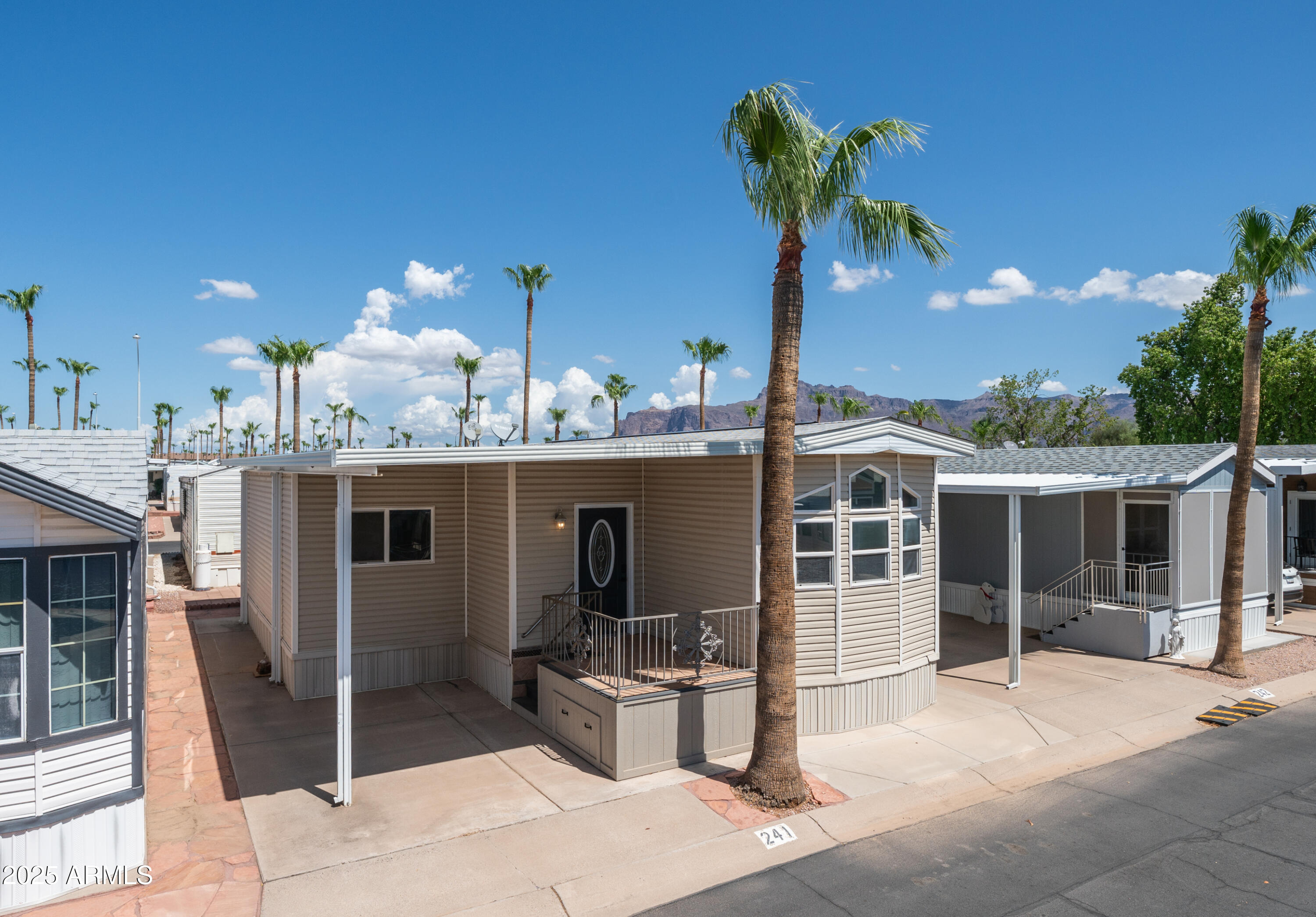 2400 East Baseline Avenue Apache Junction, AZ 85119 - Photo 2 of 64 a view of a patio with swimming pool table and chairs