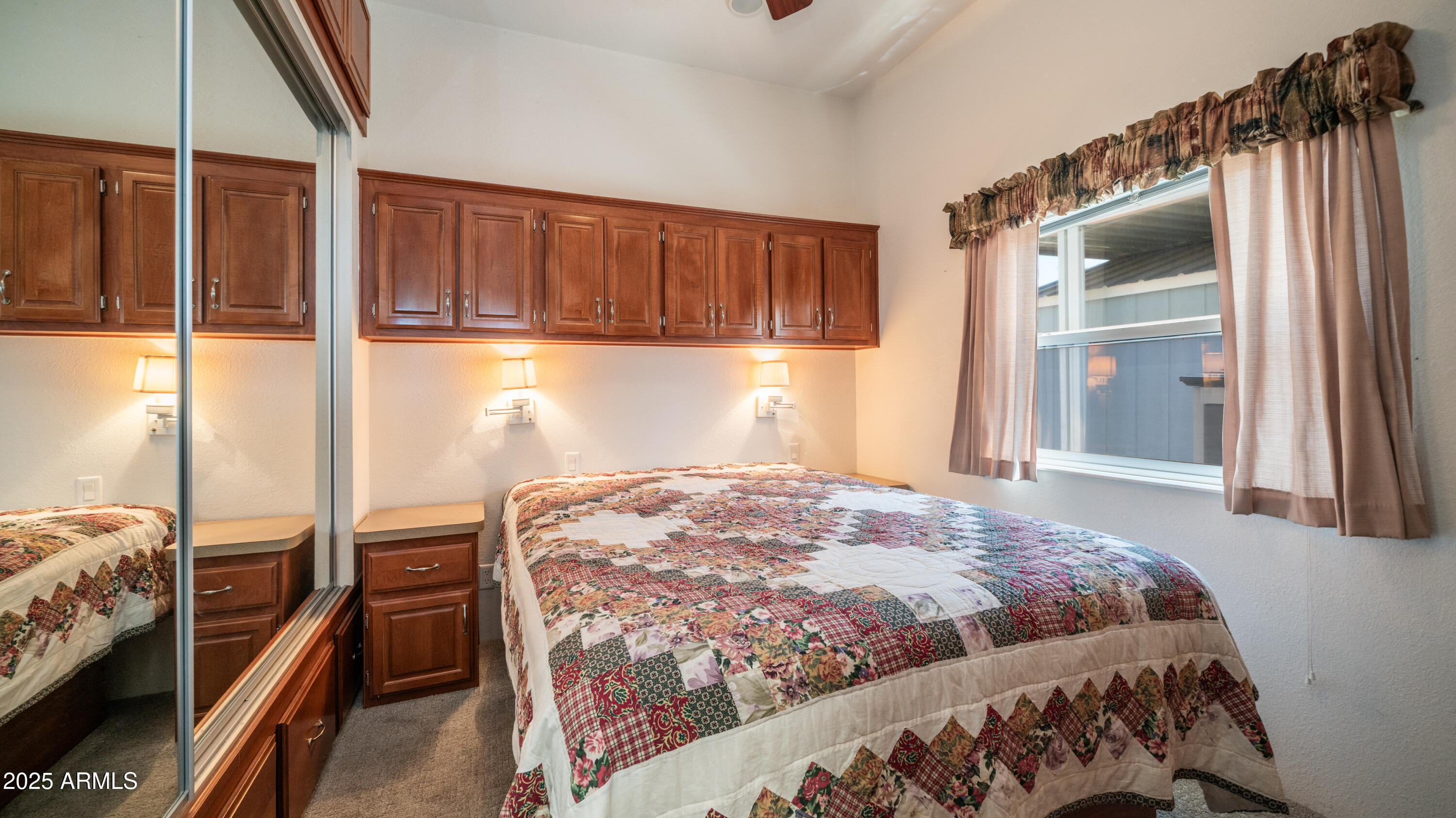 2400 East Baseline Avenue Apache Junction, AZ 85119 - Photo 22 of 64 a bed sitting in a bedroom next to a window