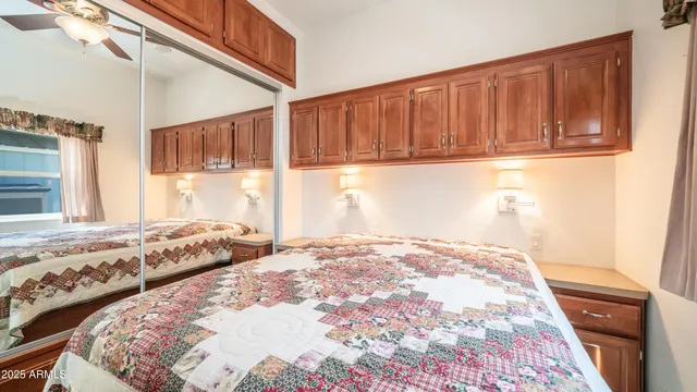 a white toilet sitting next to a shower