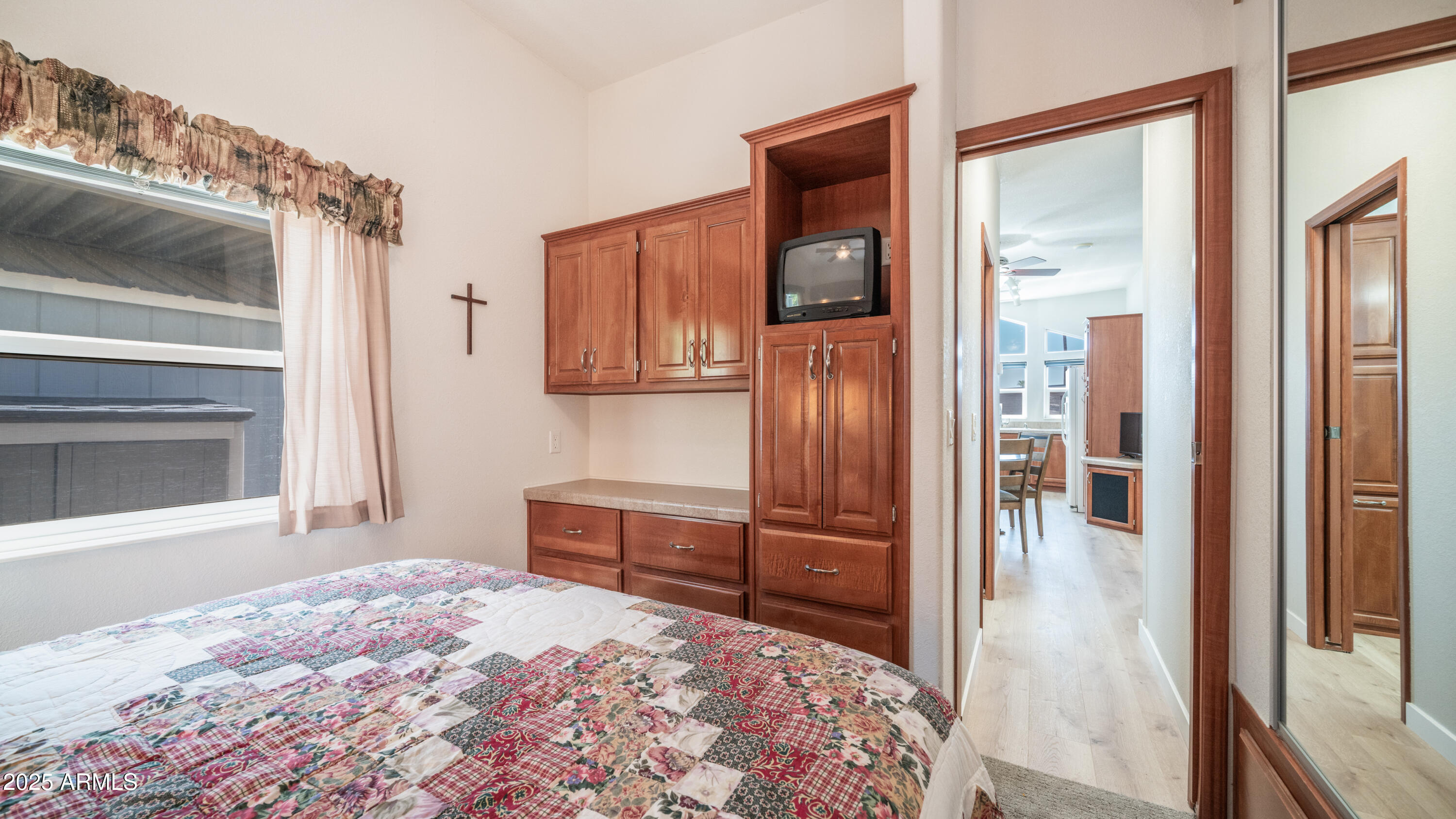 2400 East Baseline Avenue Apache Junction, AZ 85119 - Photo 24 of 64 a bedroom with a bed and a dresser