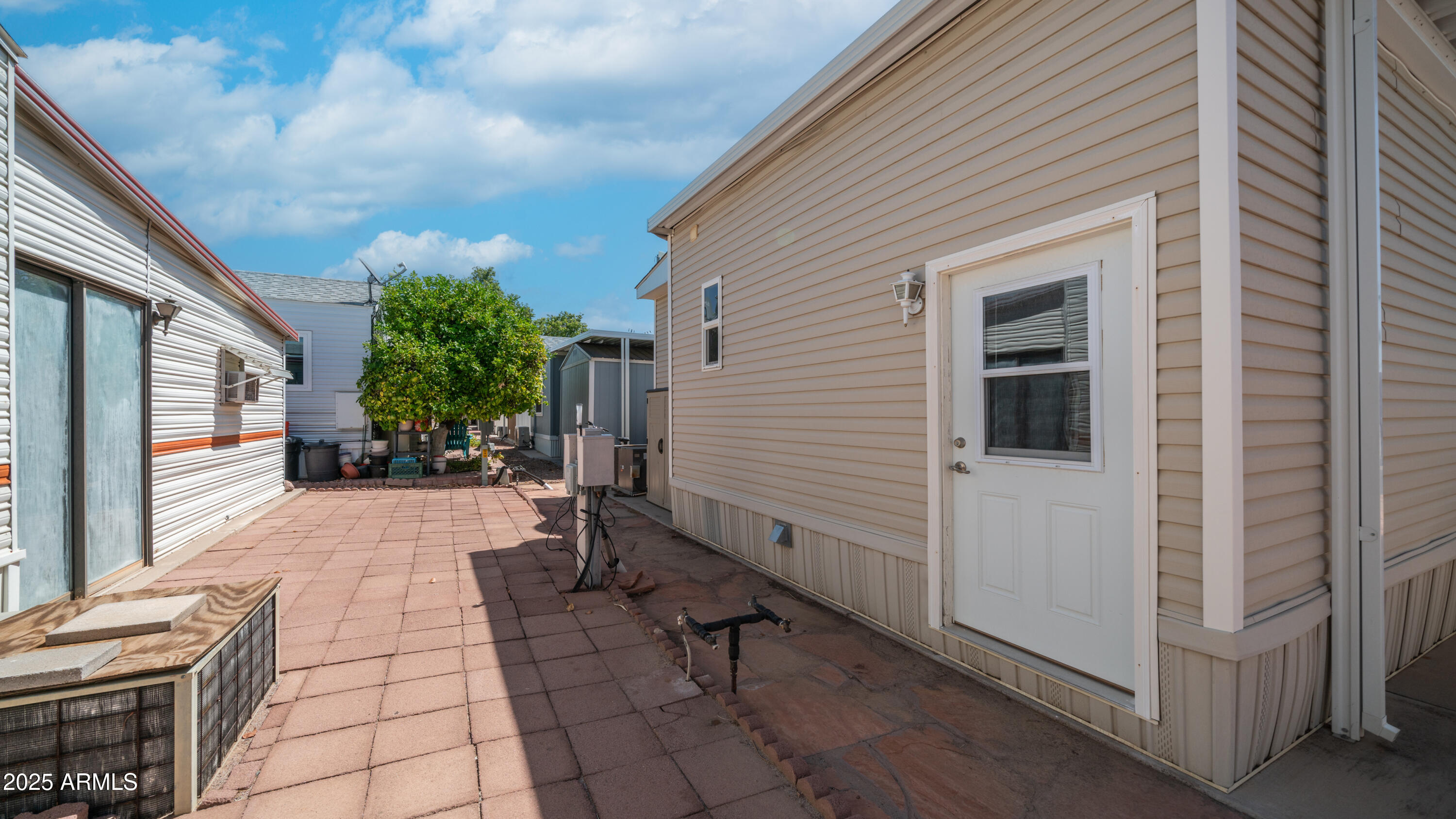 2400 East Baseline Avenue Apache Junction, AZ 85119 - Photo 30 of 64 a view of a house with backyard and sitting area