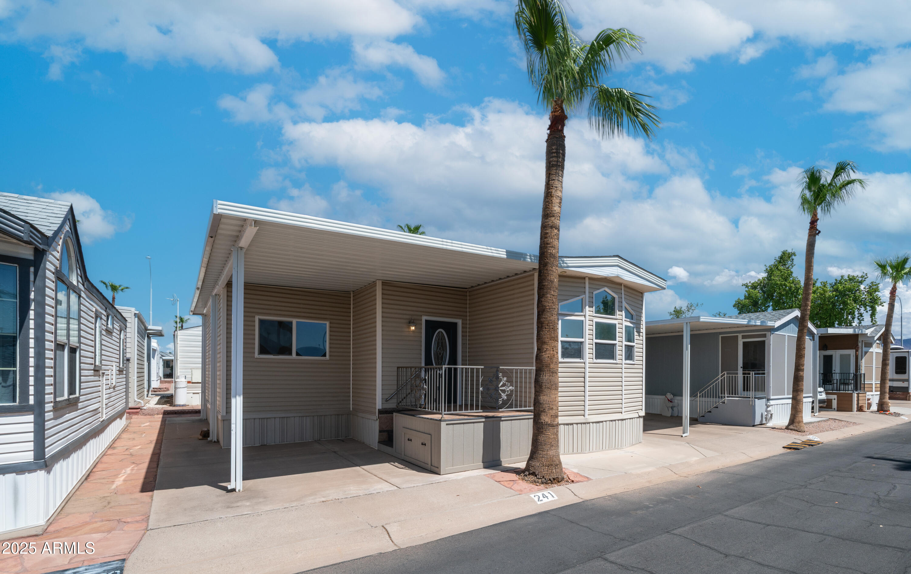 2400 East Baseline Avenue Apache Junction, AZ 85119 - Photo 3 of 64 a front view of a house with a porch