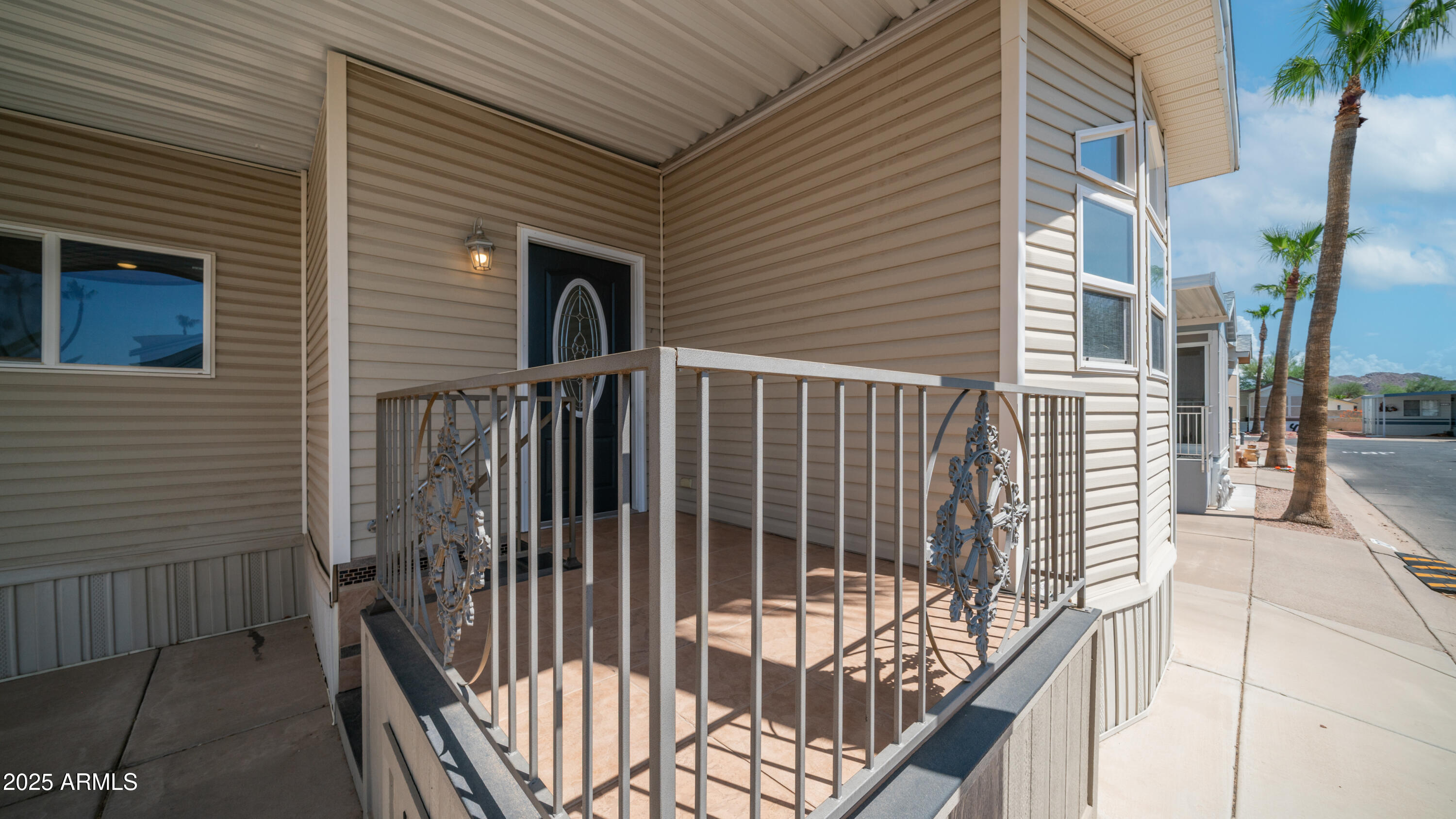 2400 East Baseline Avenue Apache Junction, AZ 85119 - Photo 7 of 64 a view of a balcony with wooden floor and fence