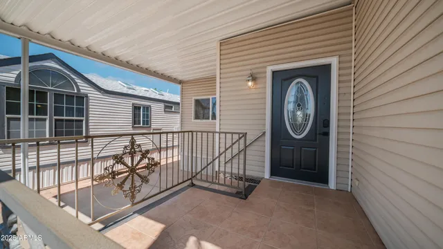a view of living room kitchen and entryway