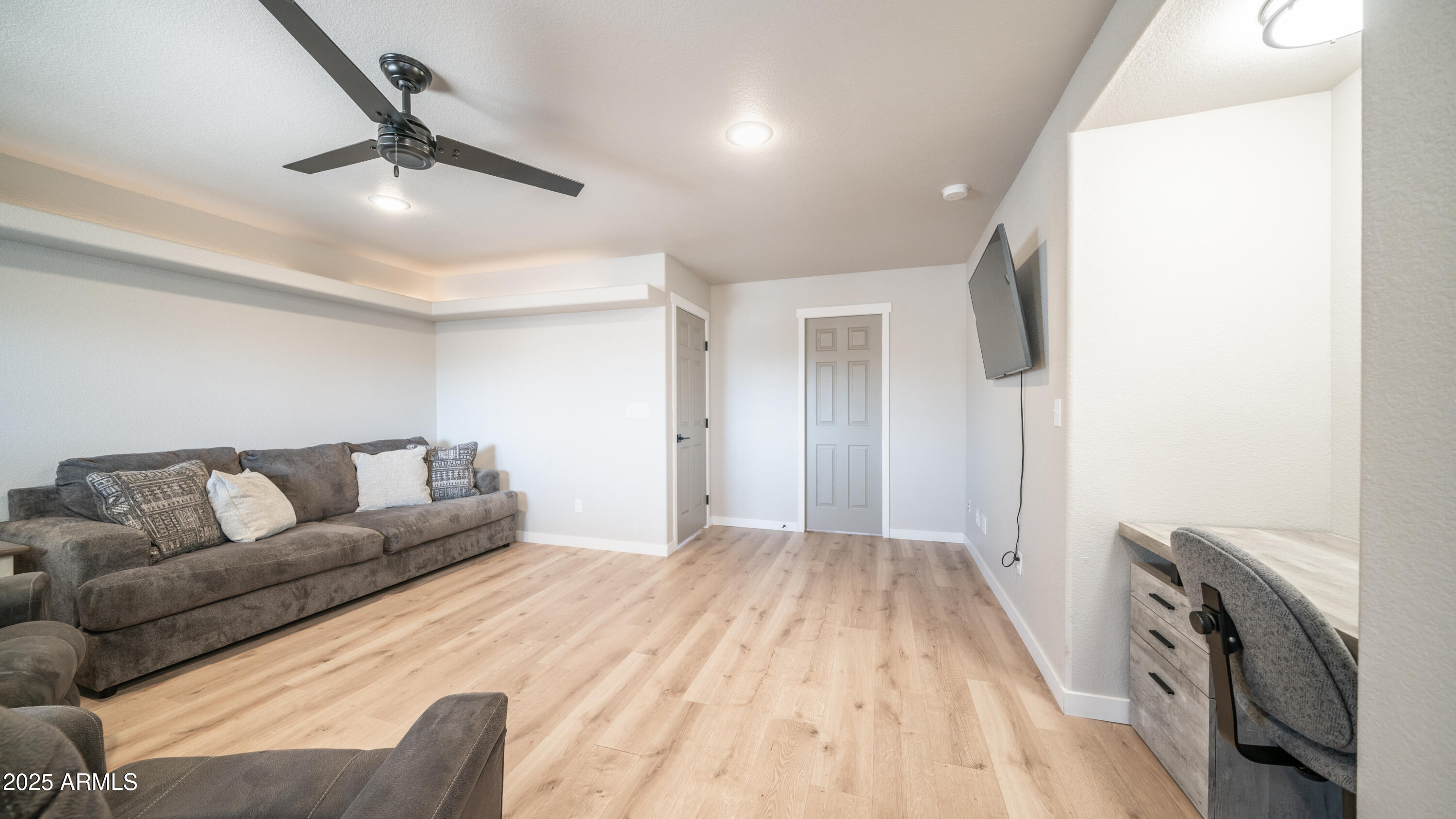 2400 East Baseline Avenue Apache Junction, AZ 85119 - Photo 10 of 64 a living room with furniture and a flat screen tv
