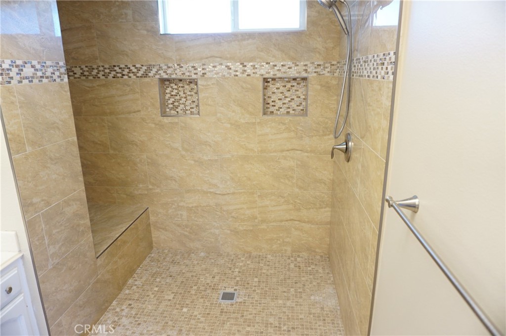 19584 Shadow Glen Circle Porter Ranch, CA 91326 - Photo 27 of 72 a bathroom with a shower