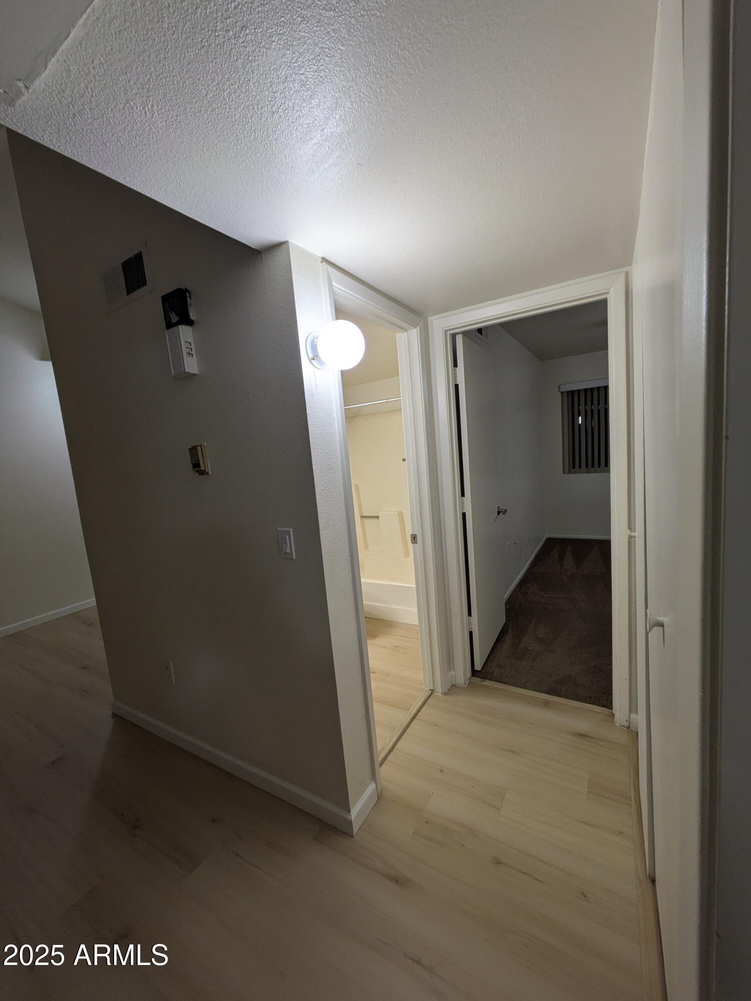 461 West Holmes Avenue, Unit 342 Mesa, AZ 85210 - Photo 16 of 21 an empty room with an entrance to other room