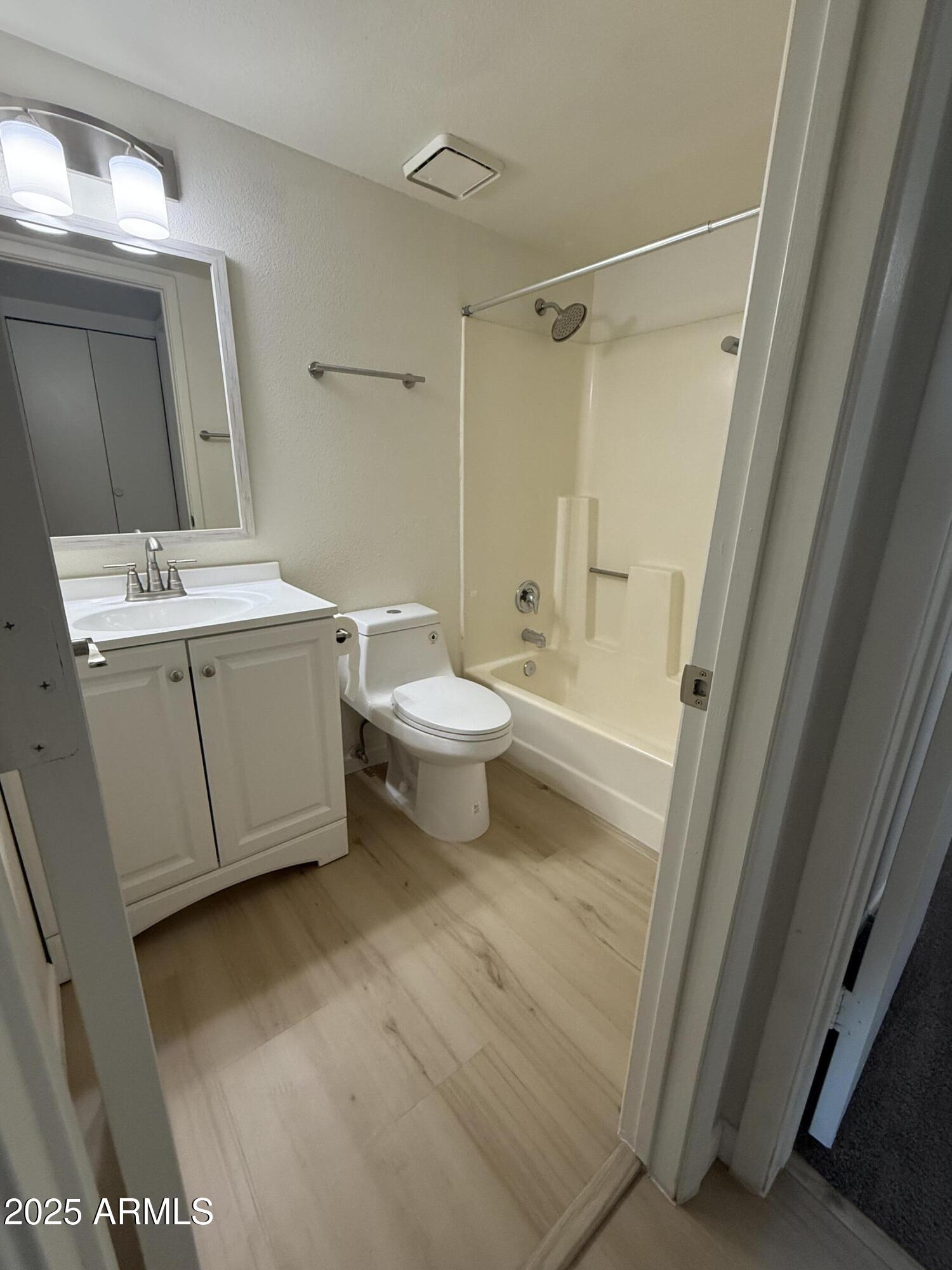 461 West Holmes Avenue, Unit 342 Mesa, AZ 85210 - Photo 10 of 21 a bathroom with a sink a toilet and shower