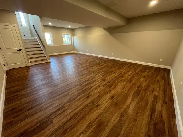 an empty room with wooden floor