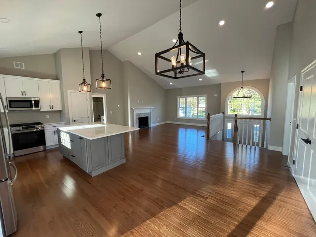 a large kitchen with a table and chairs in it