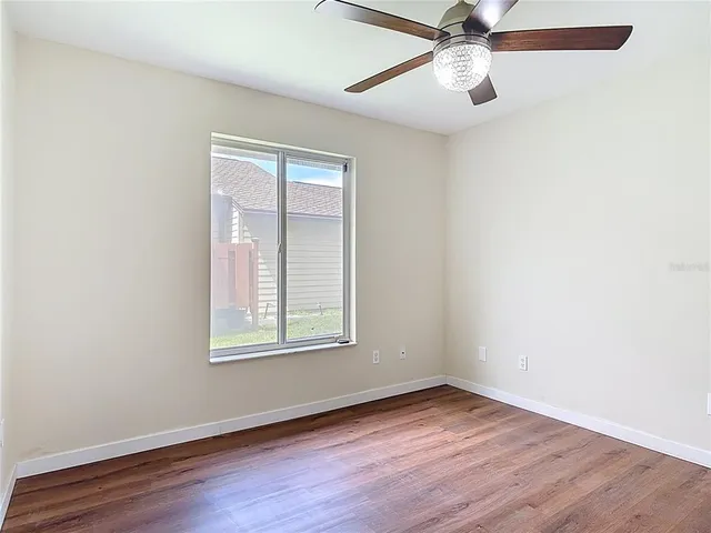 a bathroom with a sink a toilet and a large mirror