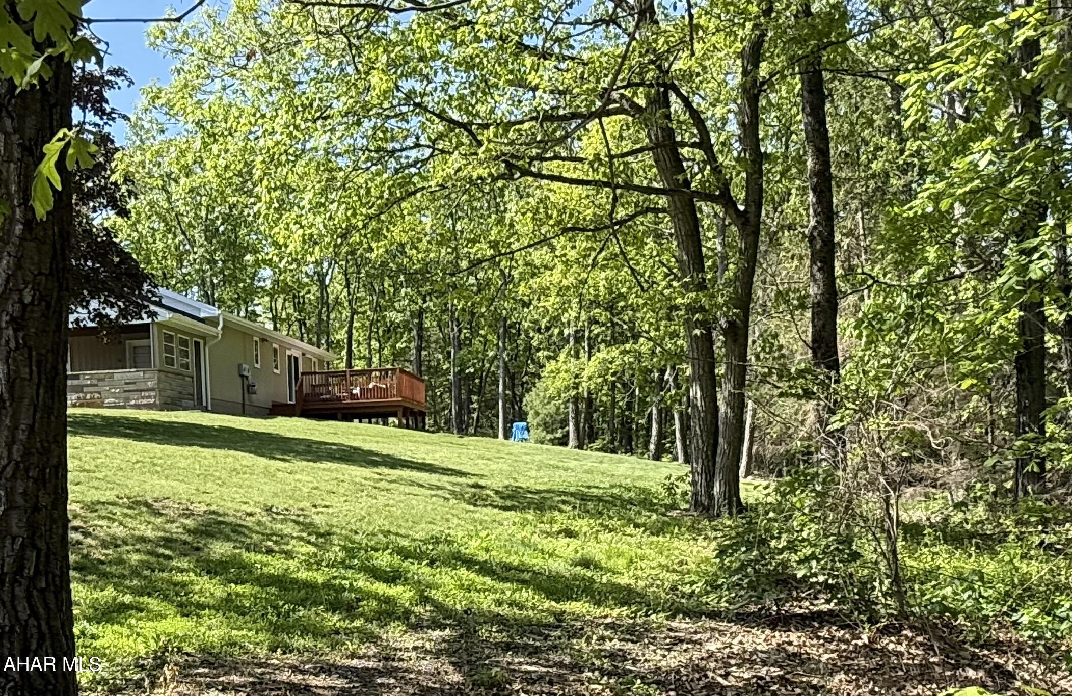 473 Calhoun Road Everett, PA 15537 - Photo 39 of 45 a backyard of a house with lots of green space