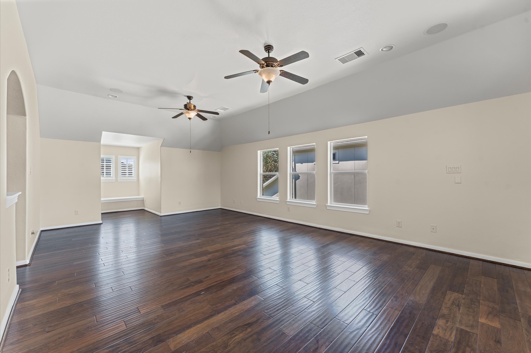 7 North Beech Springs Circle Spring, TX 77389 - Photo 34 of 50 a view of a livingroom with wooden floor and a ceiling fan
