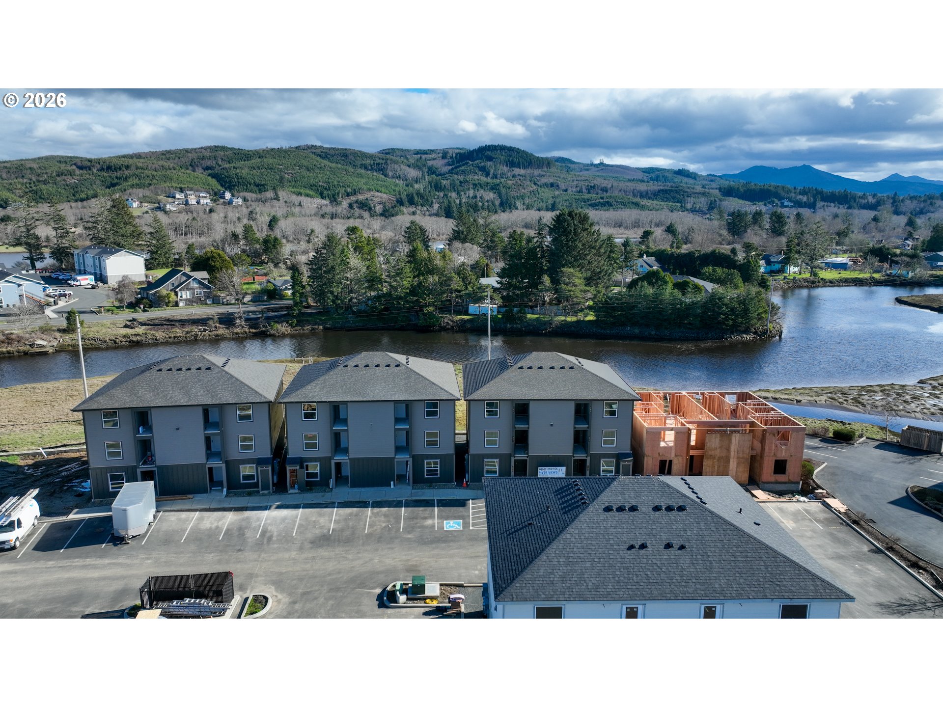 Cross Creek Street, Unit 13 Seaside, OR 97138 - Photo 16 of 18 a view of a town with an outdoor space and seating area