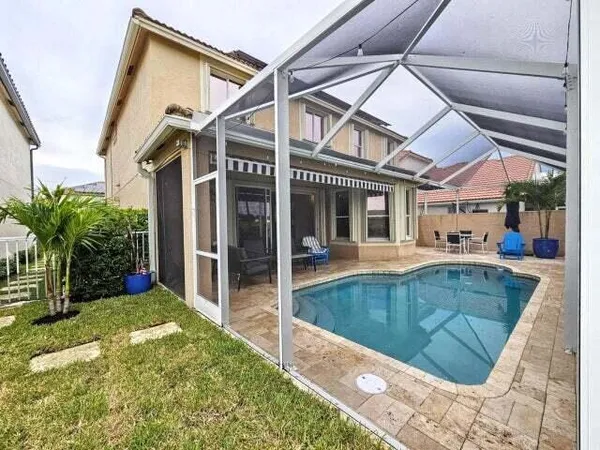 a view of a house with a swimming pool