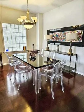 a view of a dining room with furniture window and outside view