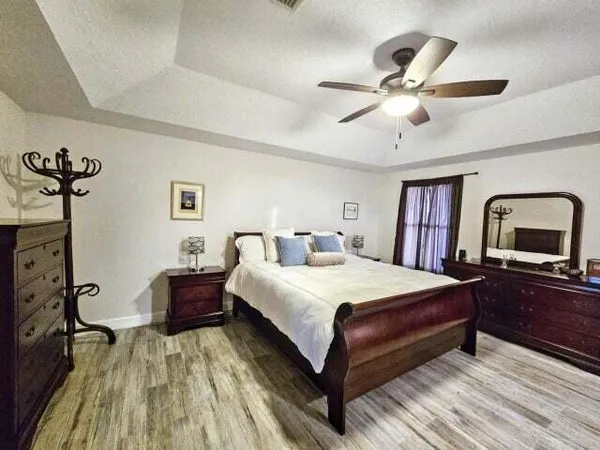 a bedroom with a bed and a dresser