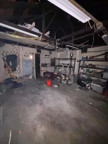 a view of parking garage with cars