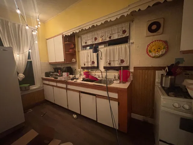 a kitchen with a sink and cabinets