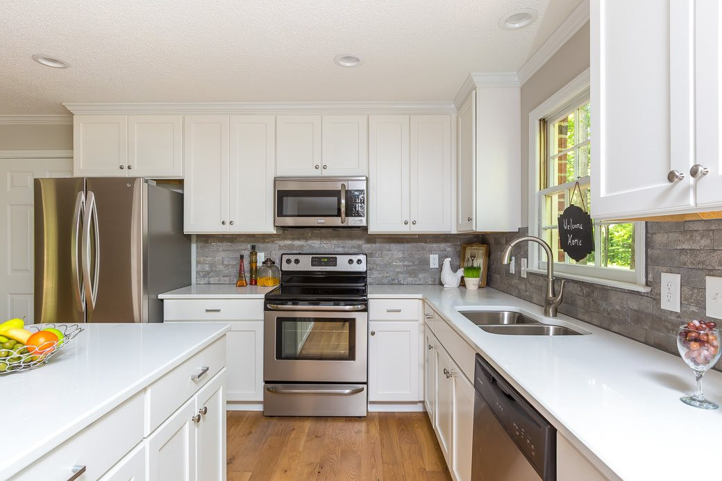 5508 Dutchman Drive Raleigh, NC 27606 - Photo 2 of 15 The kitchen has been completely remodeled, NEW EVERYTHING!! GRANITE counters, cabinets with SOFT-CLOSE drawers, STAINLESS appliances, fresh paint and beautiful WOOD flooring. Kitchen
