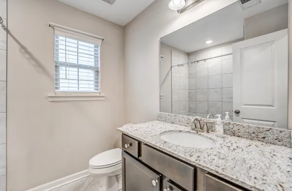 a view of small yard with wooden fence