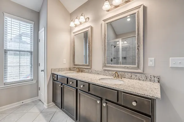a living room with furniture ceiling fan and a window