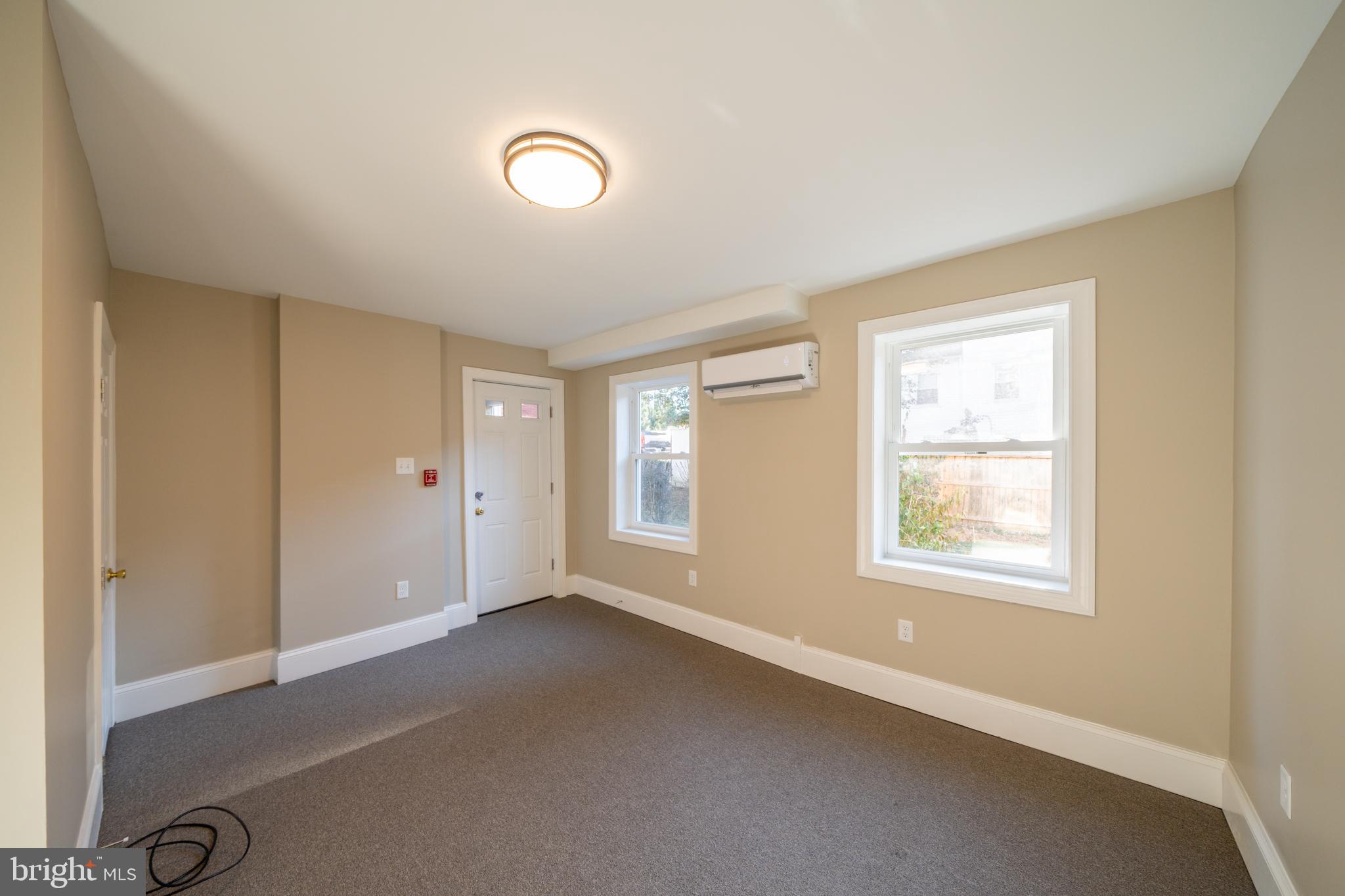 327 North High Street, Unit 1 West Chester, PA 19380 - Photo 10 of 13 a view of an empty room with a window