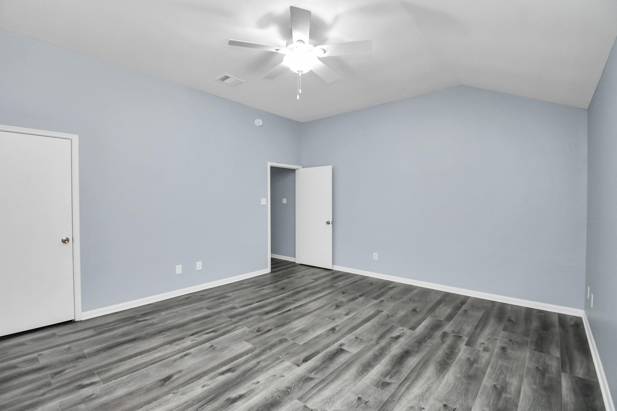 10403 Shadow Oaks Drive, Unit 3A Houston, TX 77043 - Photo 11 of 25 wooden floor in an empty room