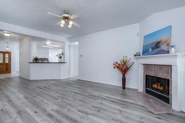 a view of a room with cabinet and a fireplace