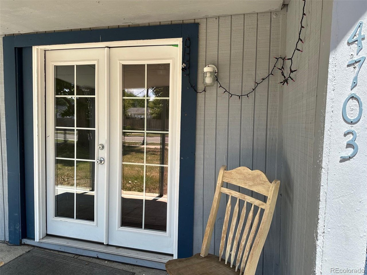 4701 Sherman Street Denver, CO 80216 - Photo 4 of 23 4703 Front porch