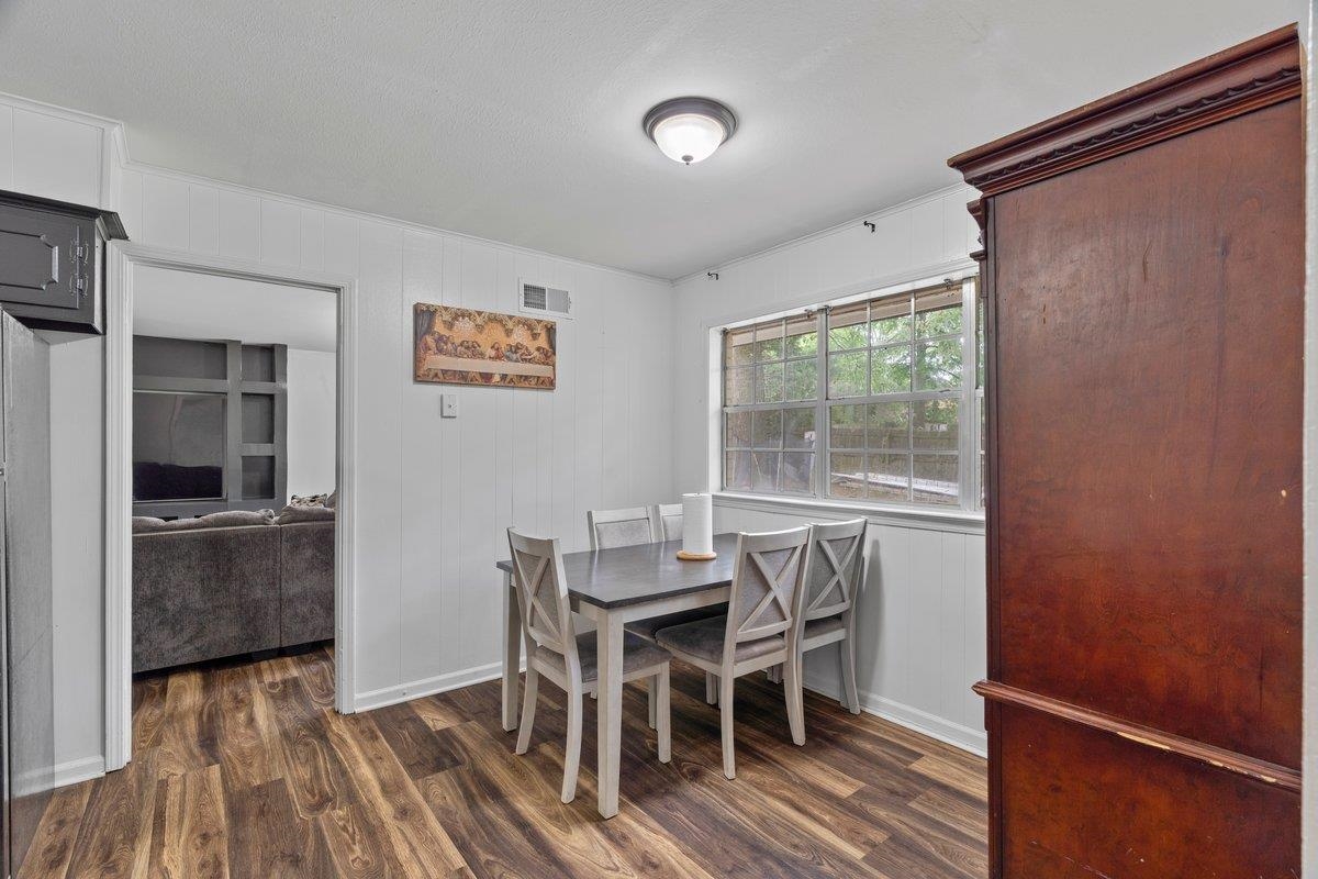 5841 Foxdale Road Memphis, TN 38115 - Photo 12 of 21 a view of a dining room with furniture window and wooden floor