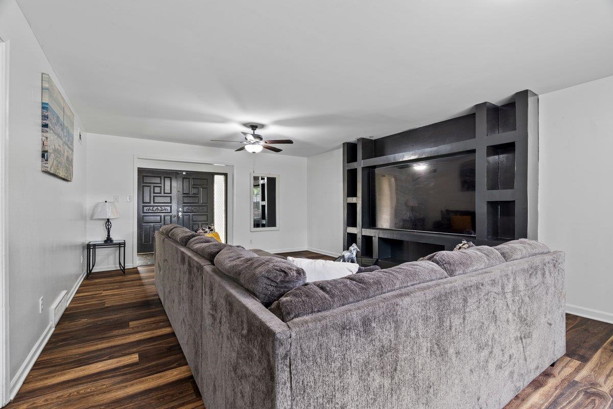 5841 Foxdale Road Memphis, TN 38115 - Photo 6 of 21 a living room with furniture and a flat screen tv