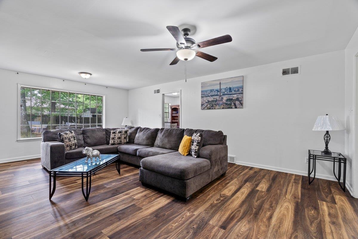 5841 Foxdale Road Memphis, TN 38115 - Photo 8 of 21 a living room with furniture and a wooden floor