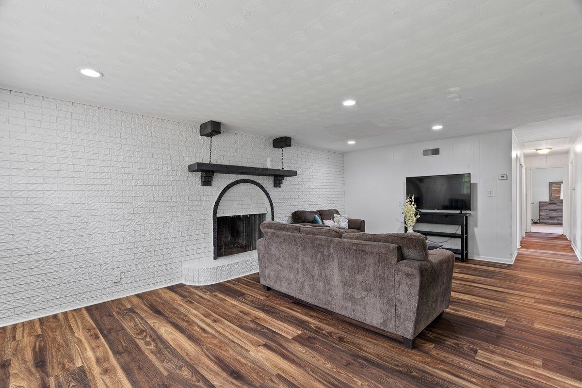 5841 Foxdale Road Memphis, TN 38115 - Photo 9 of 21 a living room with furniture and a flat screen tv