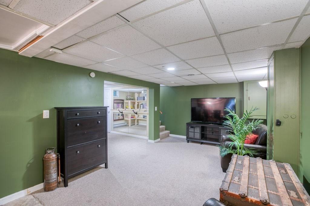 136 Webber Street Springfield, MA 01108 - Photo 21 of 29 a living room with furniture and a flat screen tv