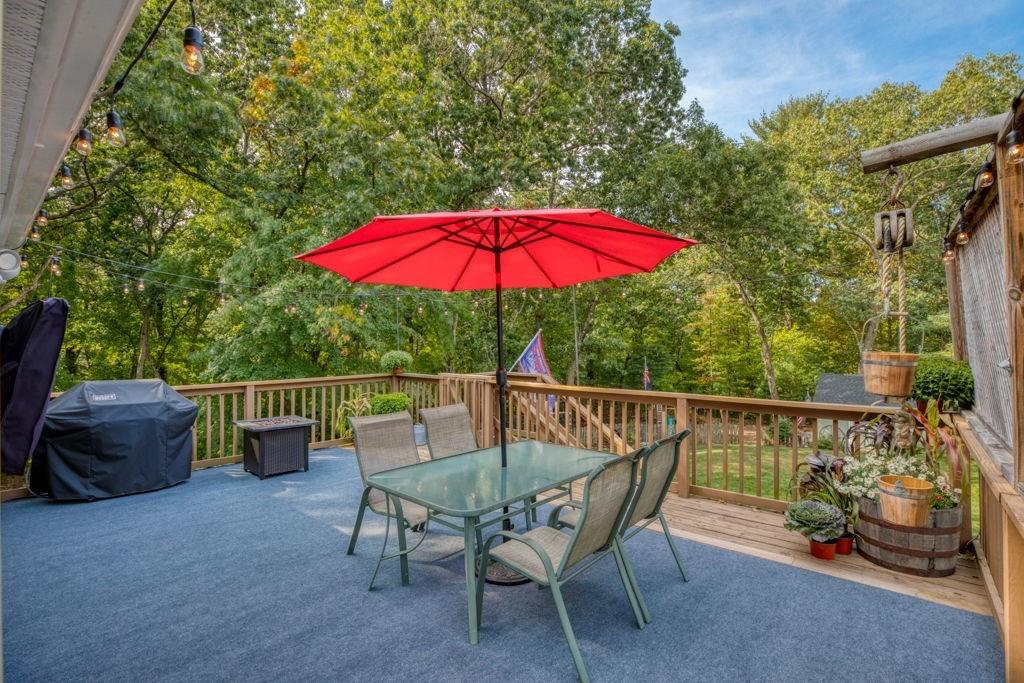 136 Webber Street Springfield, MA 01108 - Photo 24 of 29 a view of balcony with outdoor seating and wooden floor