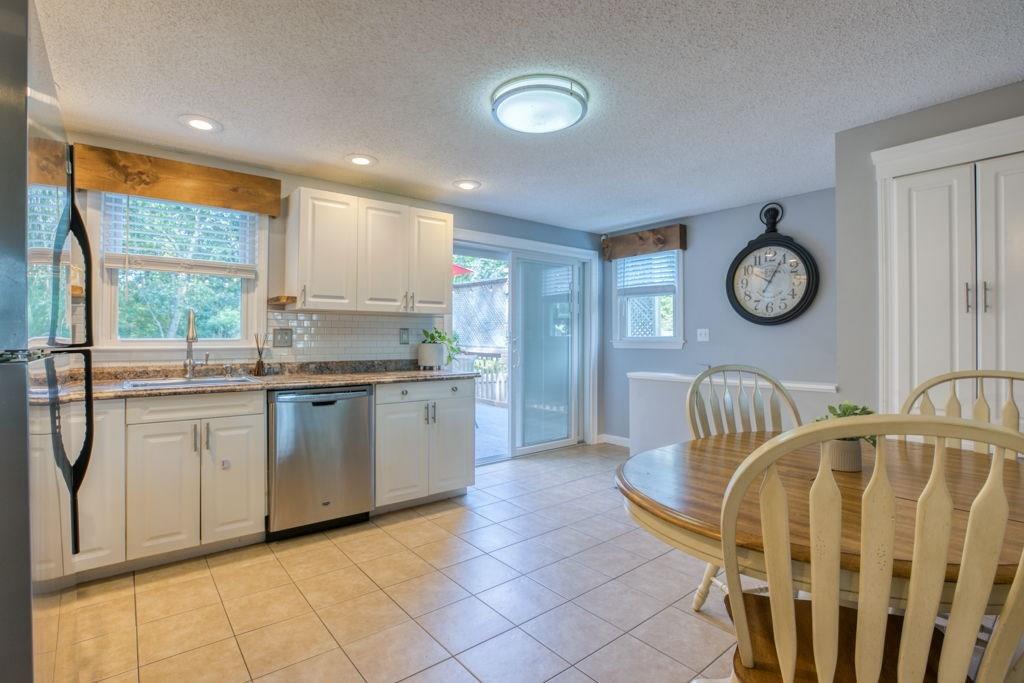 136 Webber Street Springfield, MA 01108 - Photo 5 of 29 a kitchen with a refrigerator a sink and a large window