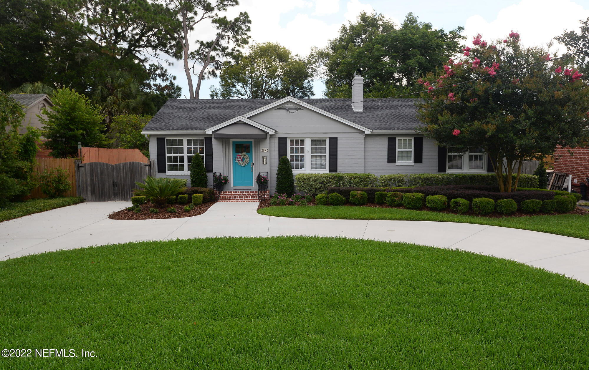 3973 Gadsden Road Jacksonville, FL 32207 - Photo 1 of 45 a front view of a house with a yard and trees