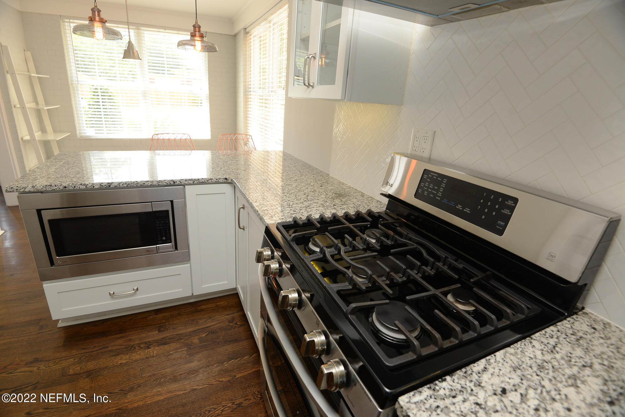 3973 Gadsden Road Jacksonville, FL 32207 - Photo 11 of 45 a stove top oven sitting inside of a kitchen